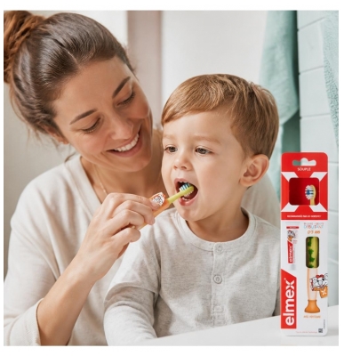 Elmex Minkštas Dantų Šepetėlis Pradedantiesiems 0-3 Metų + Mini Kariesą Saugančios Dantų Pastos 0-6 Metų 12 ml